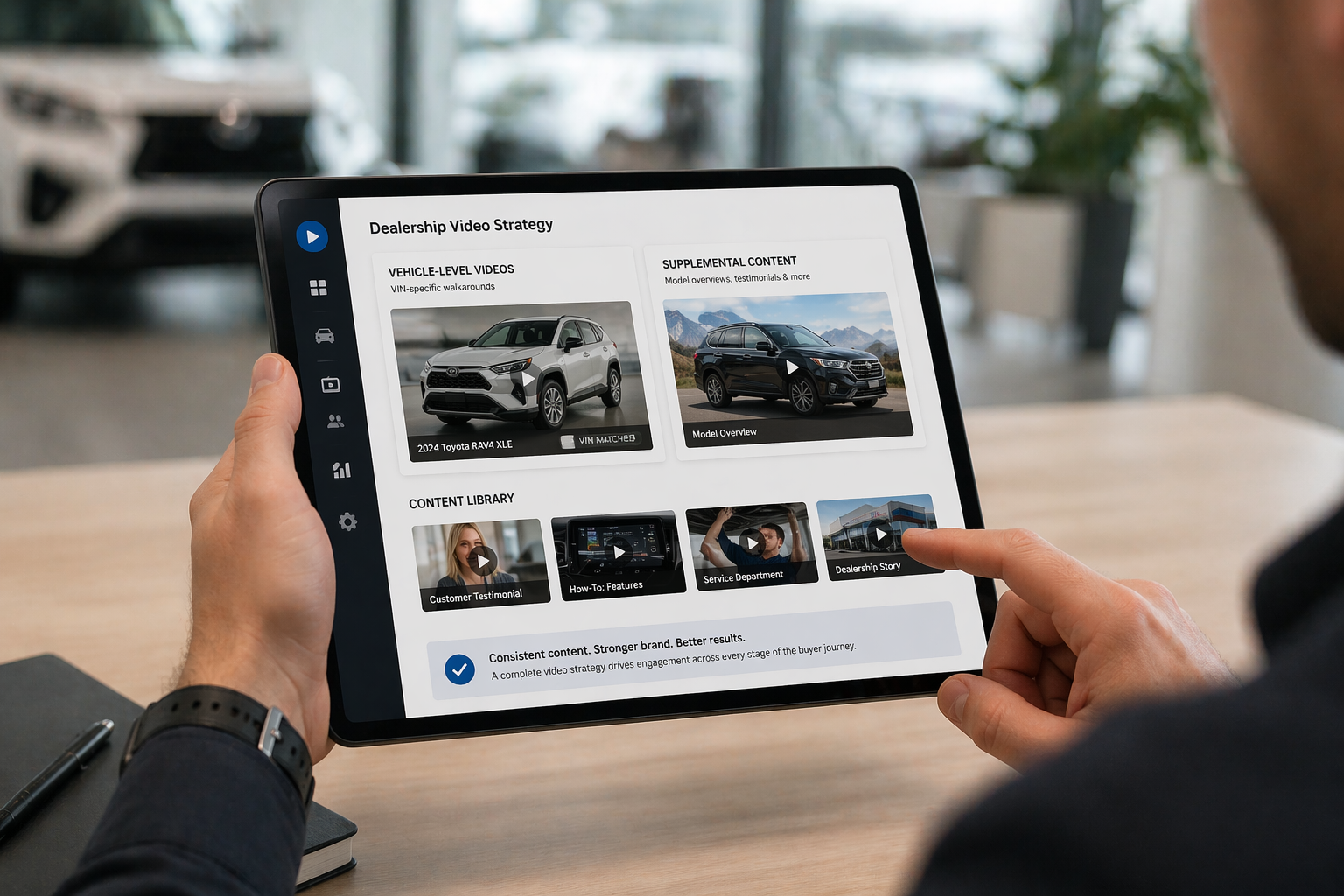 Car dealership employee browses video marketing solutions